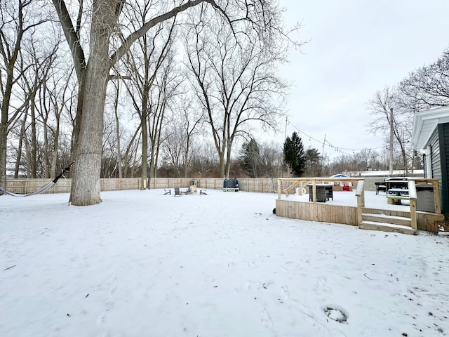 view of yard layered in snow