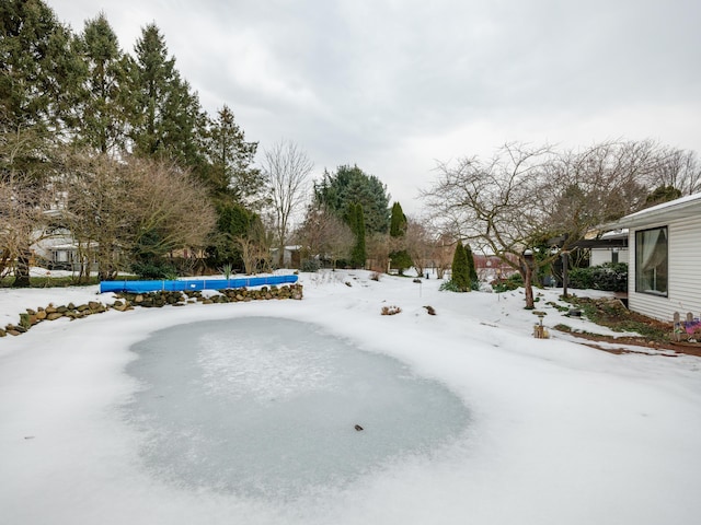 view of snow covered pool