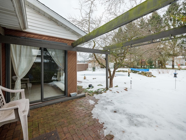 view of snow covered patio