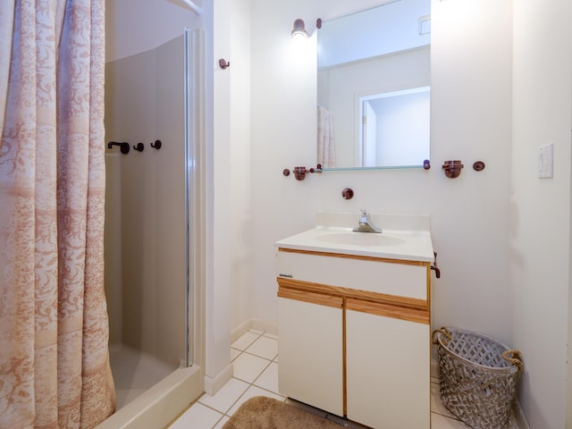 bathroom featuring tile patterned floors, a shower with shower curtain, and vanity