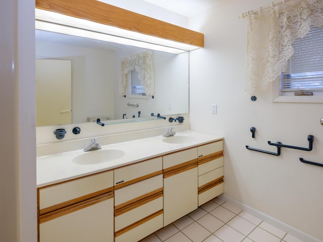 bathroom featuring tile patterned flooring and vanity