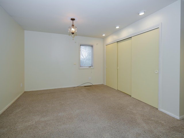 unfurnished bedroom with carpet floors and a closet