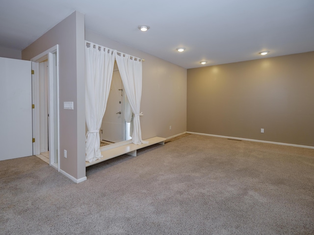 spare room with light colored carpet