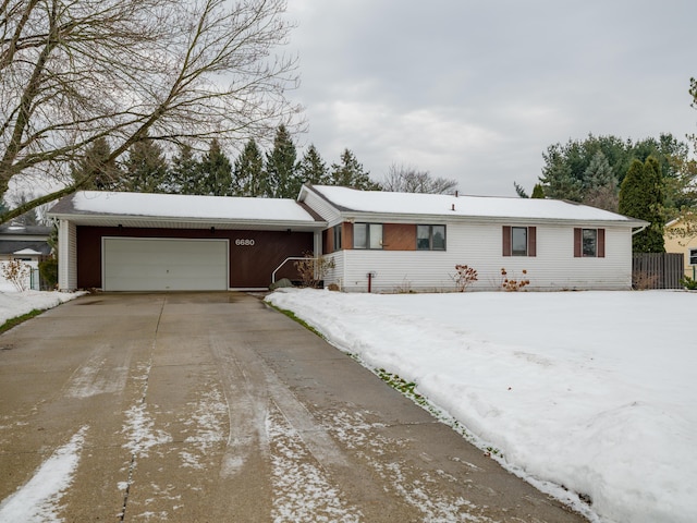 single story home featuring a garage