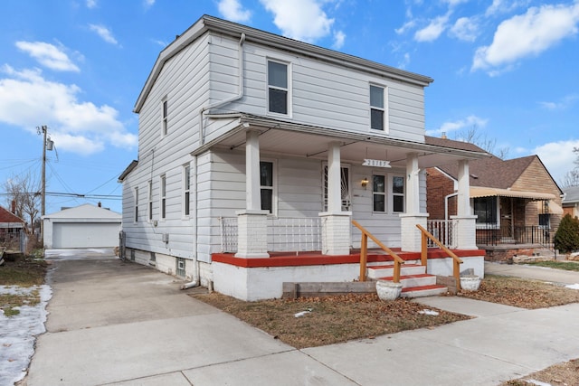 view of front of house featuring a garage, an outdoor structure, and covered porch