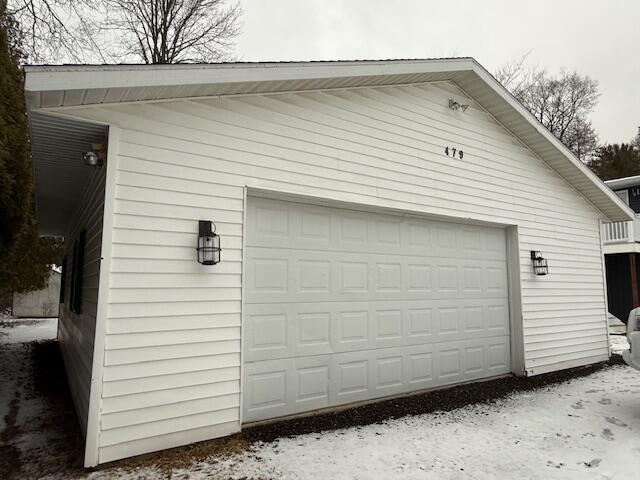 view of snow covered garage