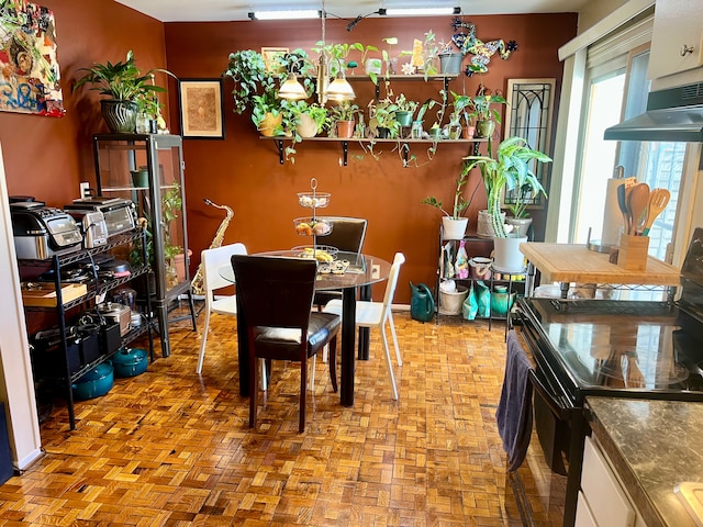 dining space featuring light parquet flooring