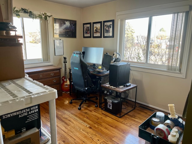 home office featuring light hardwood / wood-style floors