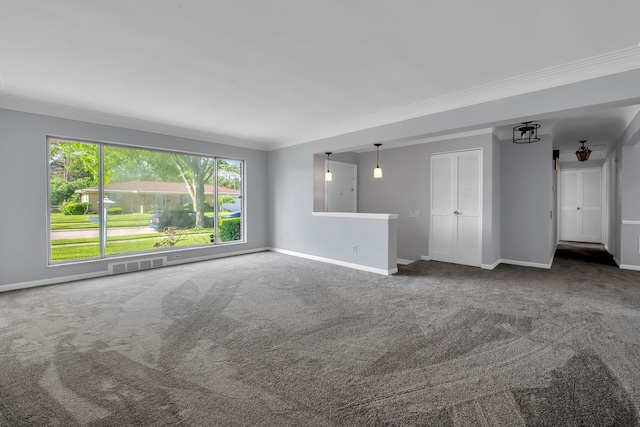 spare room with crown molding and dark carpet