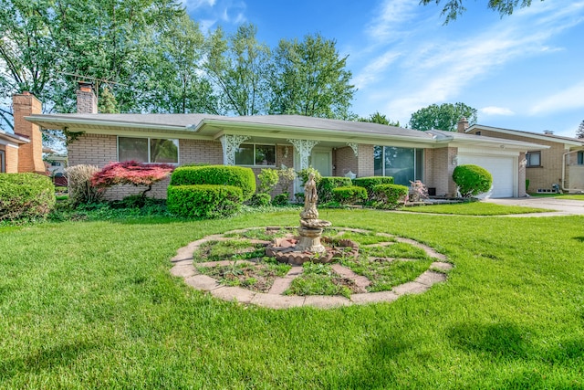 single story home featuring a garage and a front lawn