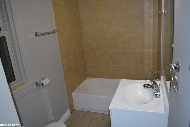 bathroom featuring vanity, tub / shower combination, and tile patterned flooring