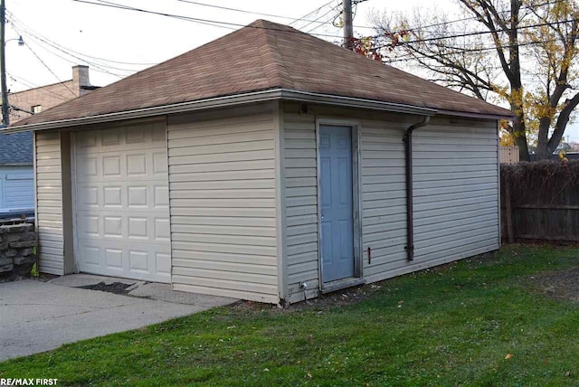 garage featuring a lawn