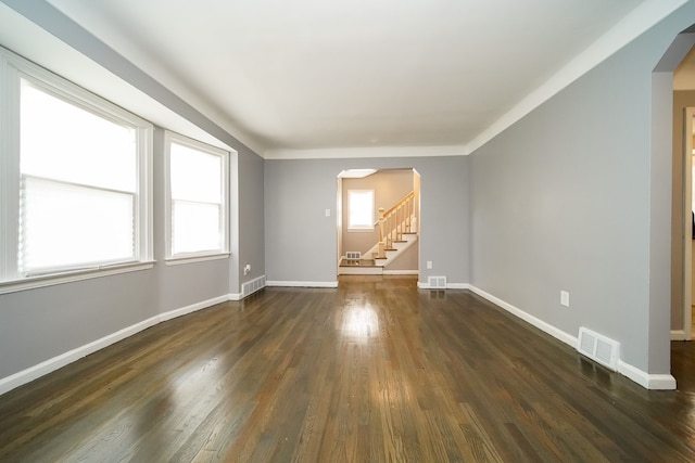 unfurnished room with dark hardwood / wood-style flooring