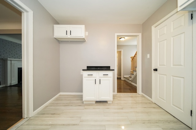 hall with light hardwood / wood-style floors