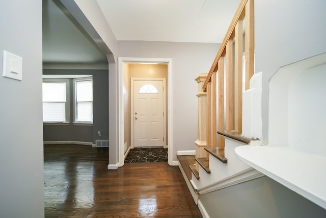 entryway with dark hardwood / wood-style floors