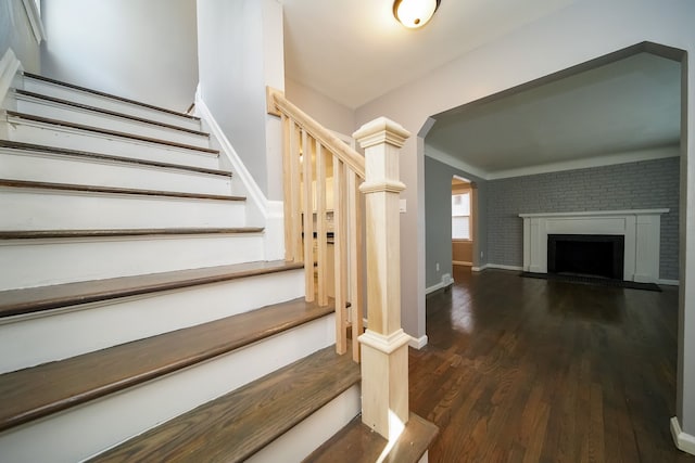 stairway featuring wood-type flooring