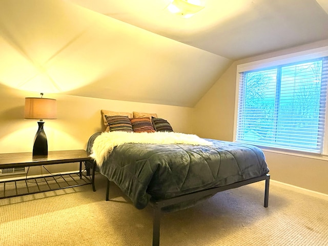 bedroom with lofted ceiling and carpet