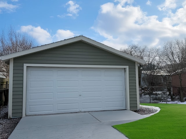 garage featuring a lawn