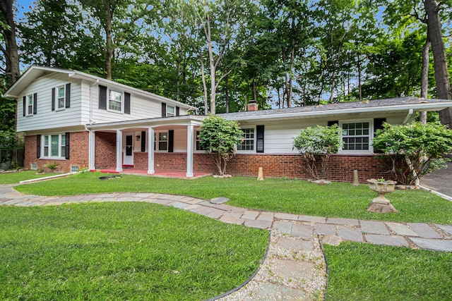 view of front of property with a porch and a front yard