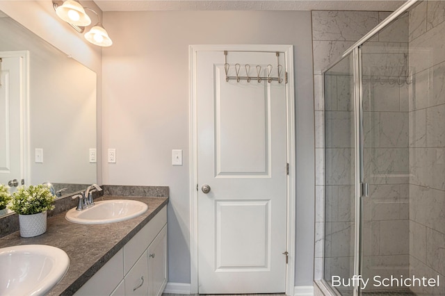 bathroom with vanity and an enclosed shower