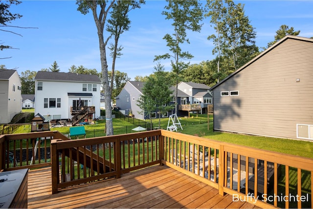 wooden terrace with a lawn