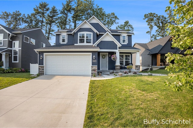 craftsman-style home with a garage and a front lawn