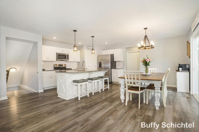 dining room featuring dark hardwood / wood-style floors and a notable chandelier