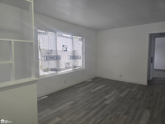 empty room featuring dark hardwood / wood-style floors