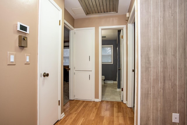 hallway with light hardwood / wood-style flooring