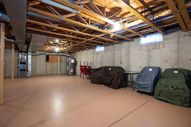 basement featuring heating unit and gas water heater