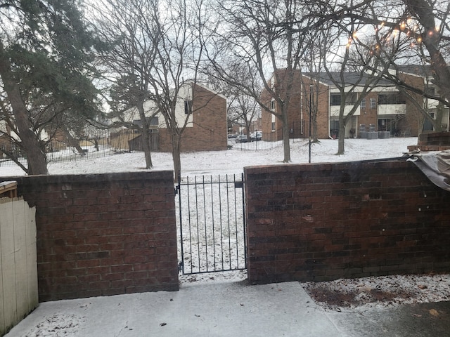 view of snow covered gate