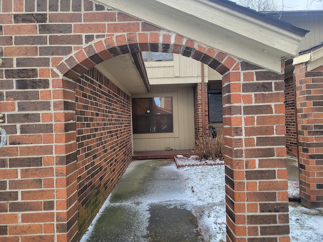 view of snow covered property entrance