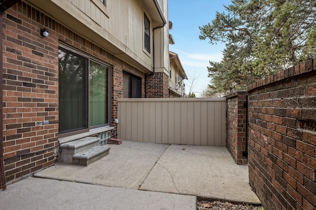 view of patio with entry steps and fence