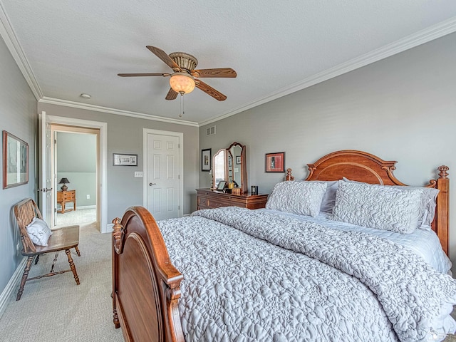 bedroom featuring light carpet, a textured ceiling, ornamental molding, and ceiling fan