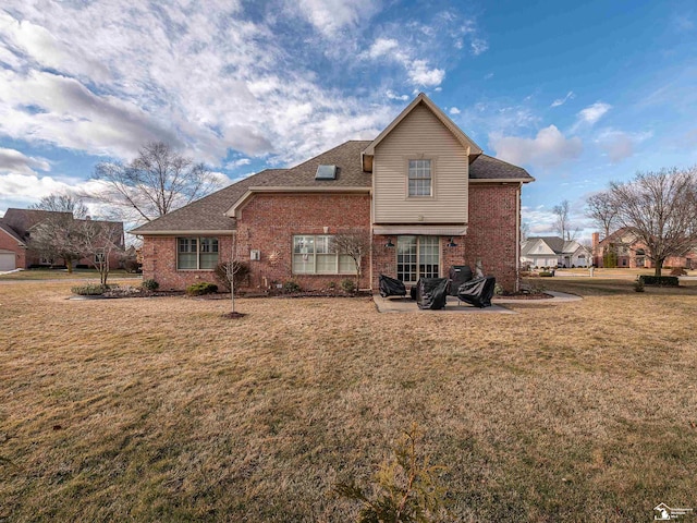 back of property with a patio and a lawn