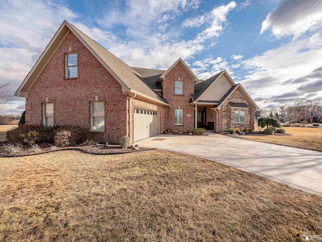 view of front property with a garage and a front yard