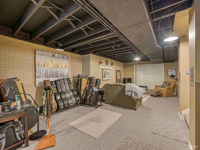 basement with brick wall and carpet floors