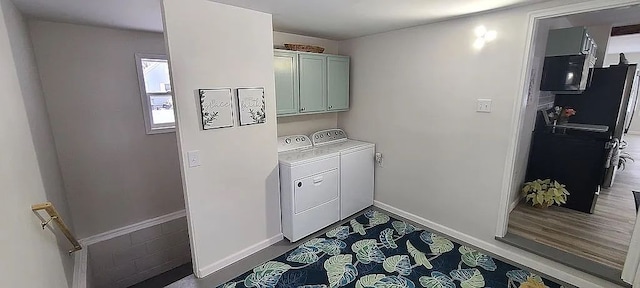 laundry room featuring cabinets and independent washer and dryer