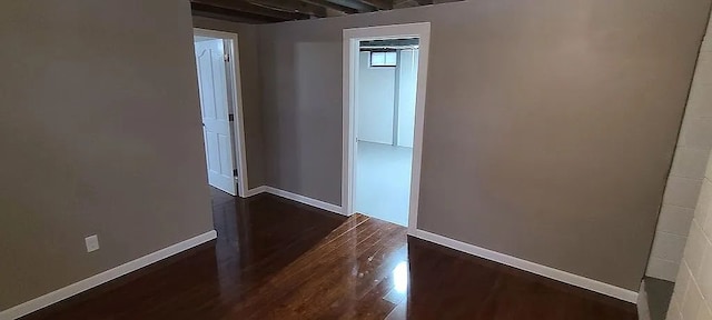 unfurnished room featuring dark hardwood / wood-style floors