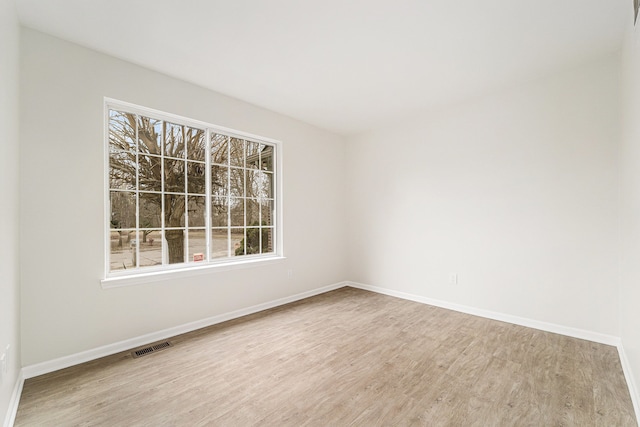 empty room with wood-type flooring