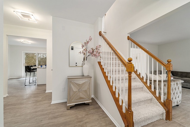 staircase featuring hardwood / wood-style floors