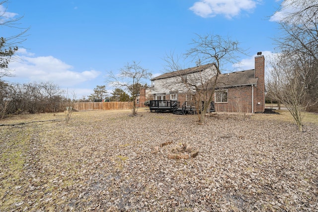 back of property featuring a deck