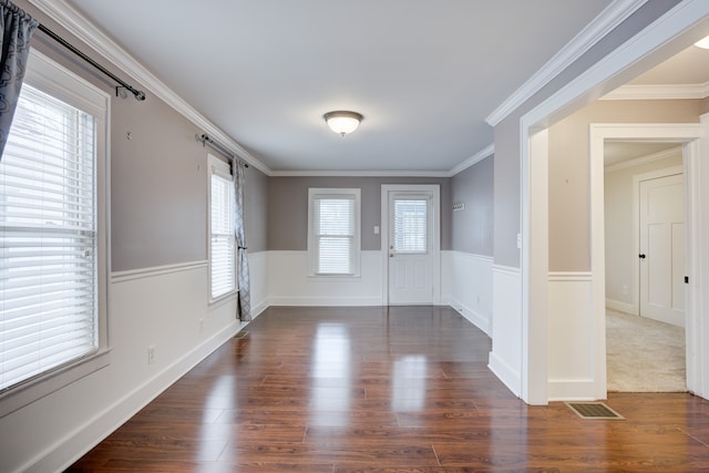 entrance foyer with crown molding and dark wood-type flooring