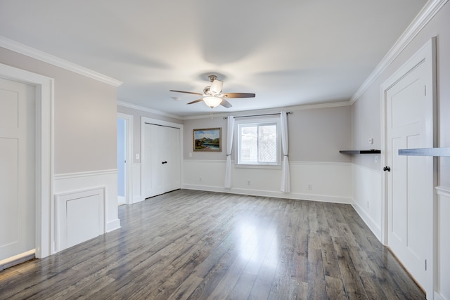 unfurnished room with crown molding, ceiling fan, and dark hardwood / wood-style flooring