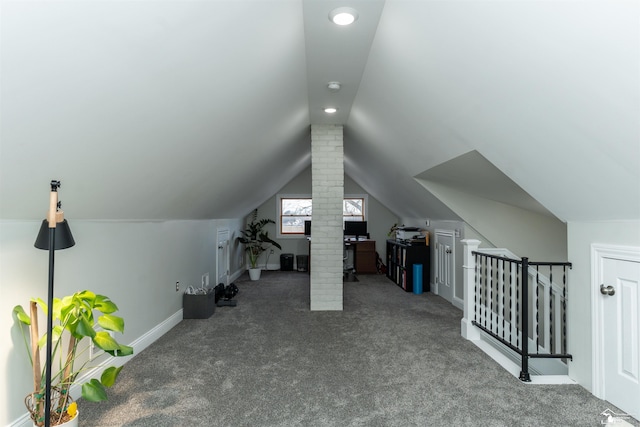 additional living space featuring vaulted ceiling and carpet