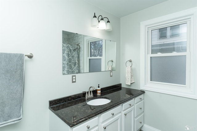 bathroom featuring a shower with curtain and vanity