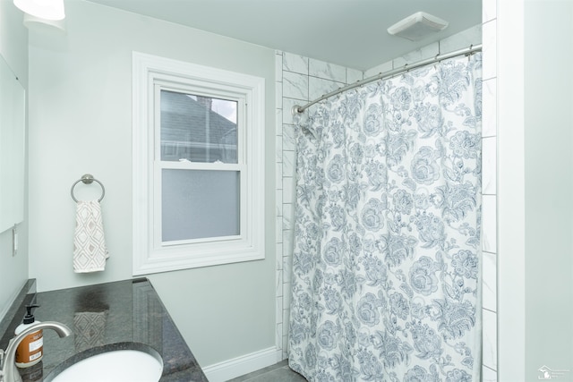 bathroom with vanity and curtained shower