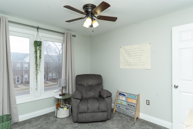 sitting room with carpet and ceiling fan