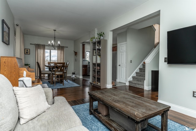 living room featuring dark hardwood / wood-style flooring and a notable chandelier