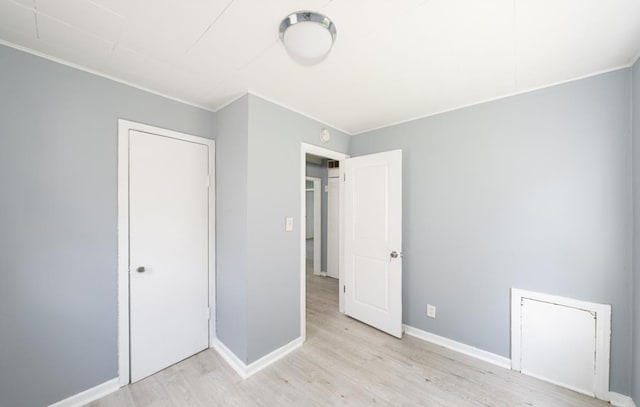 unfurnished bedroom featuring light wood-type flooring